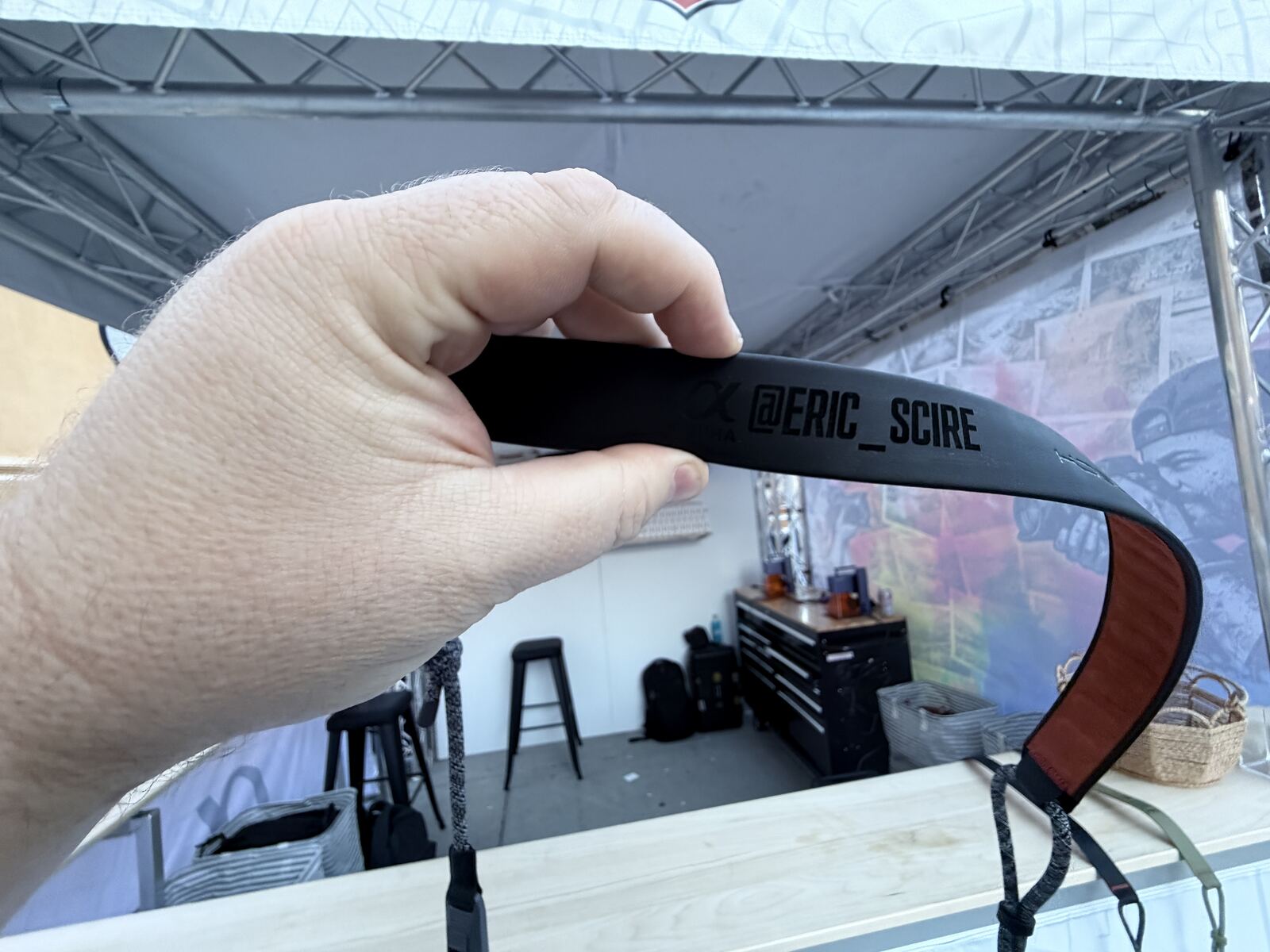 Hand holding a personalized item made live at an event activation station